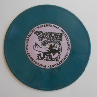 Teal green colored record opaque vinyl 7 inch record