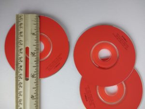 Ruler against a 3 inch CD to show the size
